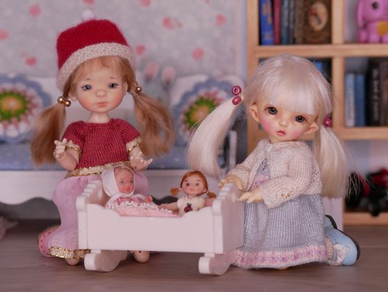 Emily and Thumbelina love their beautiful dollies.