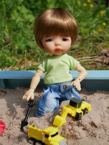 With Little Digger in the sand box.